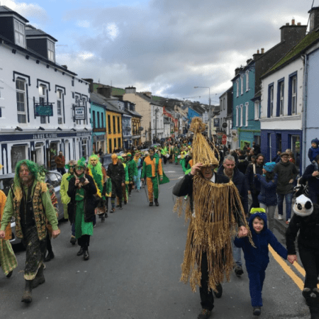Green & Gold Wran showing costumes, strawboy and Wran Captain complete with sword
